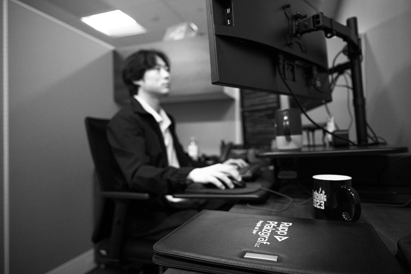 actually-work staff member reviewing work on computer screens